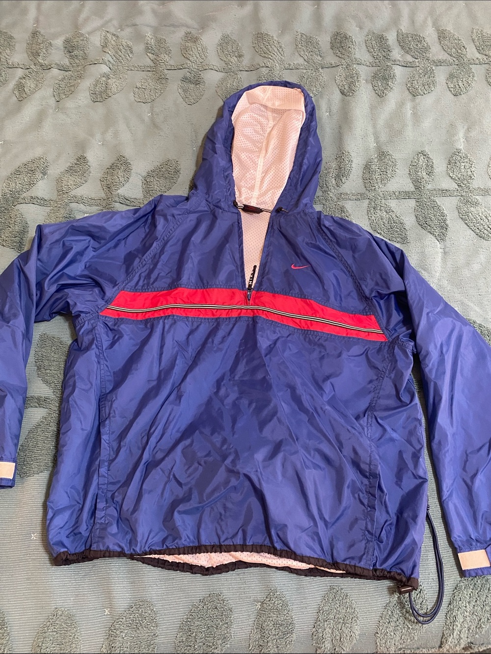 Nike Blue women’s Hooded windbreaker with red stripe detail